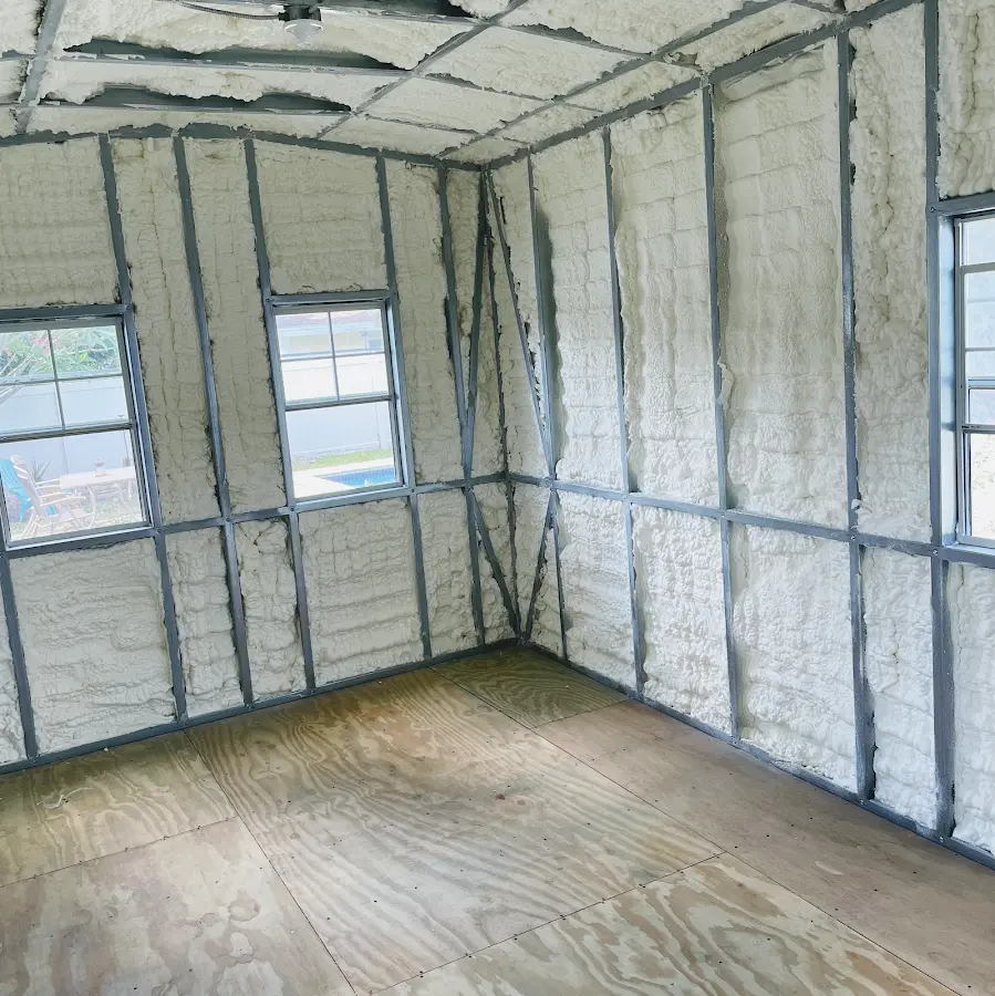 Closed-cell spray foam insulation applied to wall cavities in a residential project in Jefferson